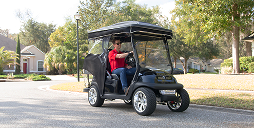 Driving a golf cart in the neighborhood