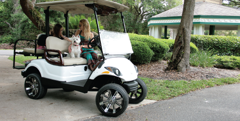 Lifted golf cart with large wheels and tires